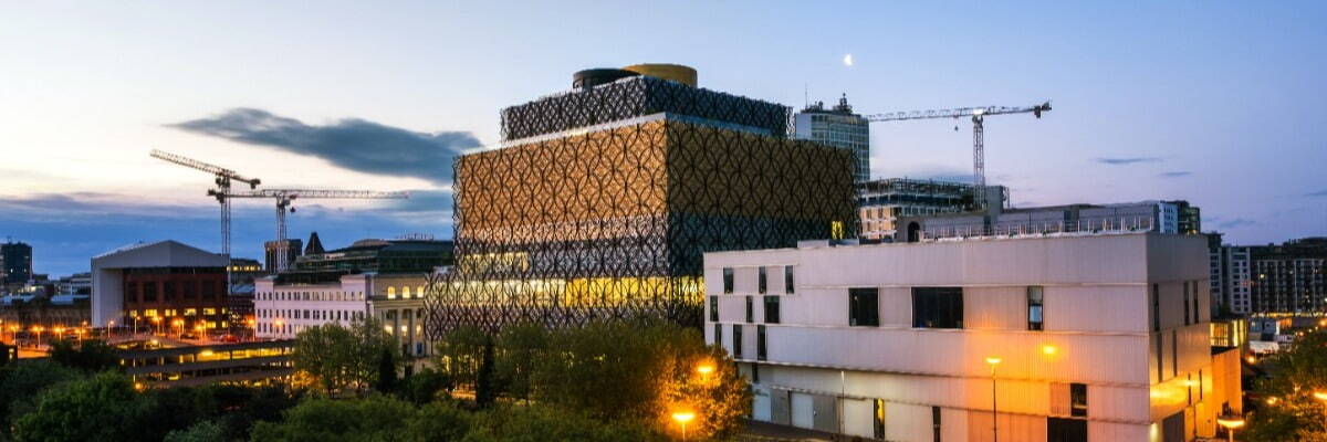 Birmingham, UK. Aerial view of Repertory Theater in Birmingham, UK in the morning. Clear sky at sunrise with illuminated modern buildings